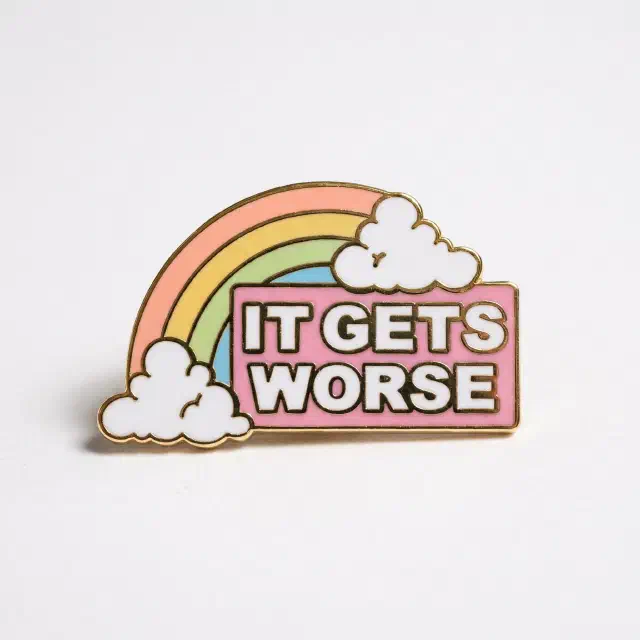 A rainbow enamel pin reading 'It gets worse'.